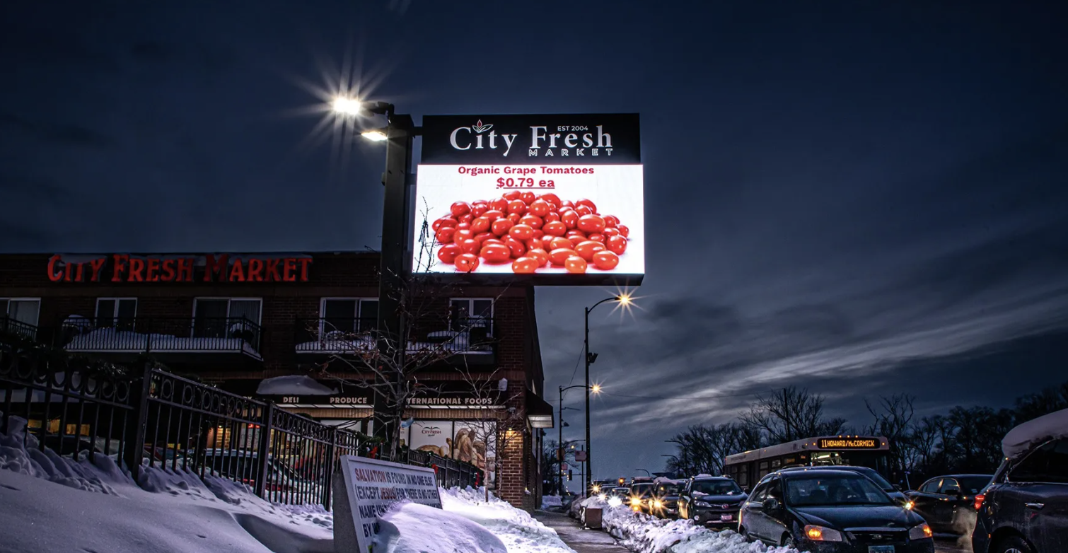 Digital LED sign in a city at night showing crisp, high-resolution content
